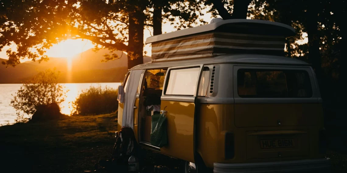 brown van under the tree during sunset